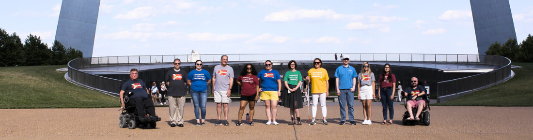Group photo of Starkloff staff and board members in front of the Arch