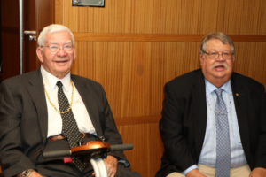 Robert H. Graebe with guest outside ballroom