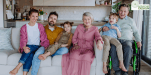 A smiling, multigenerational family at home including wheelchair user. Universal Design.