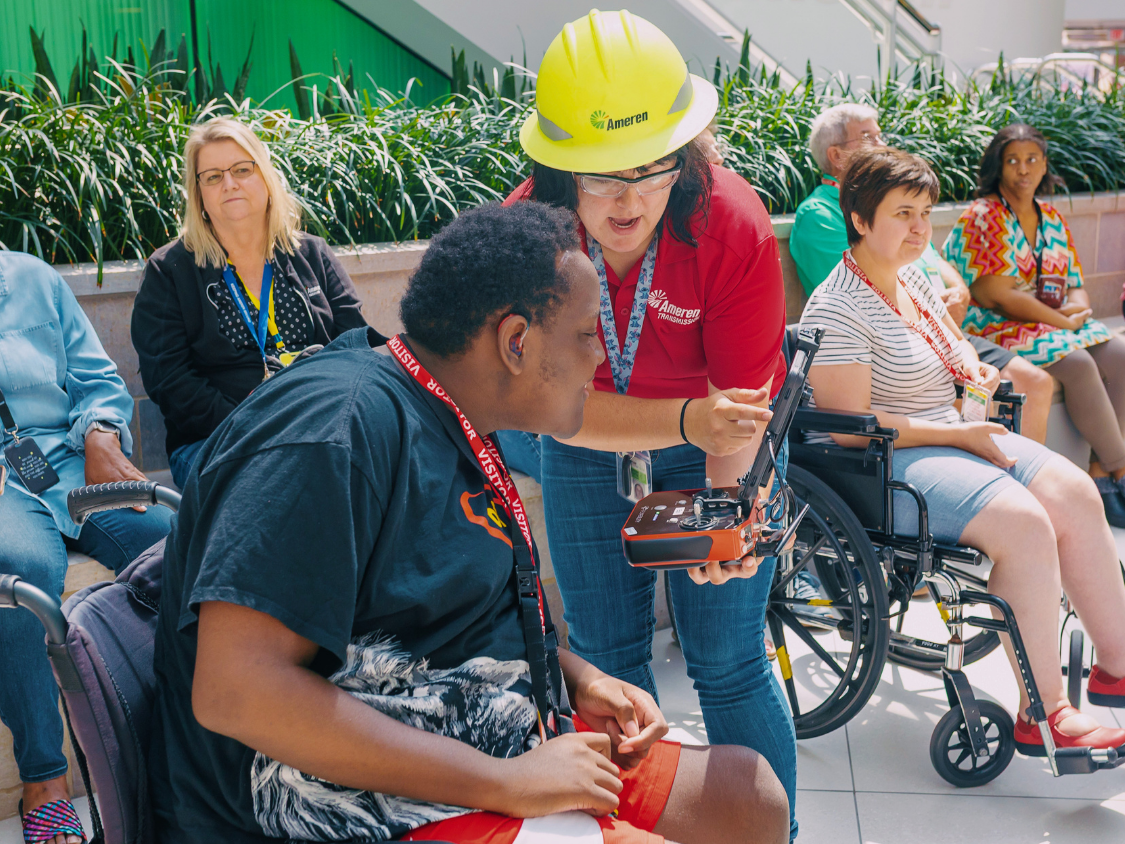 Dream Big Camp visit to Ameren where an employee shows a student how they remotely control drones to assist their work.