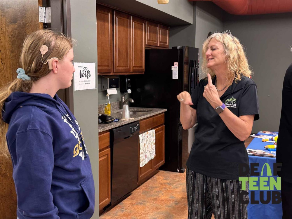 An ASL conversation between an adult and a teen. Deaf Teen Club.