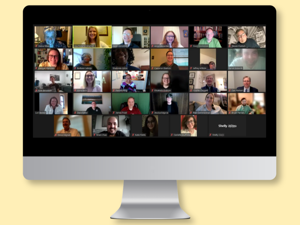 SCA graduation on Zoom Zoom meeting screen filled with smiling faces.